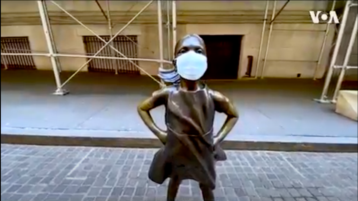 statue of little girl wearing a face mask
