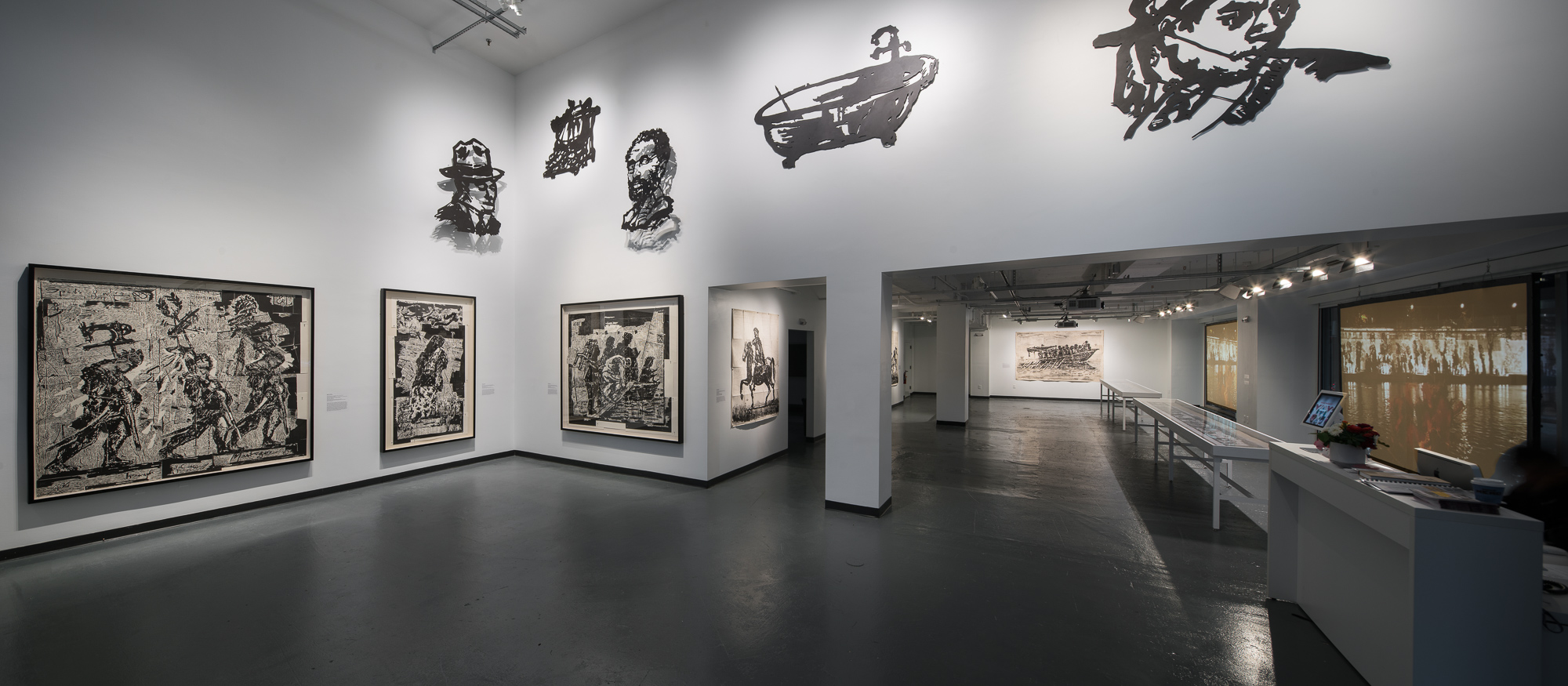 long view of gallery with images of William Kentridge's works on walls